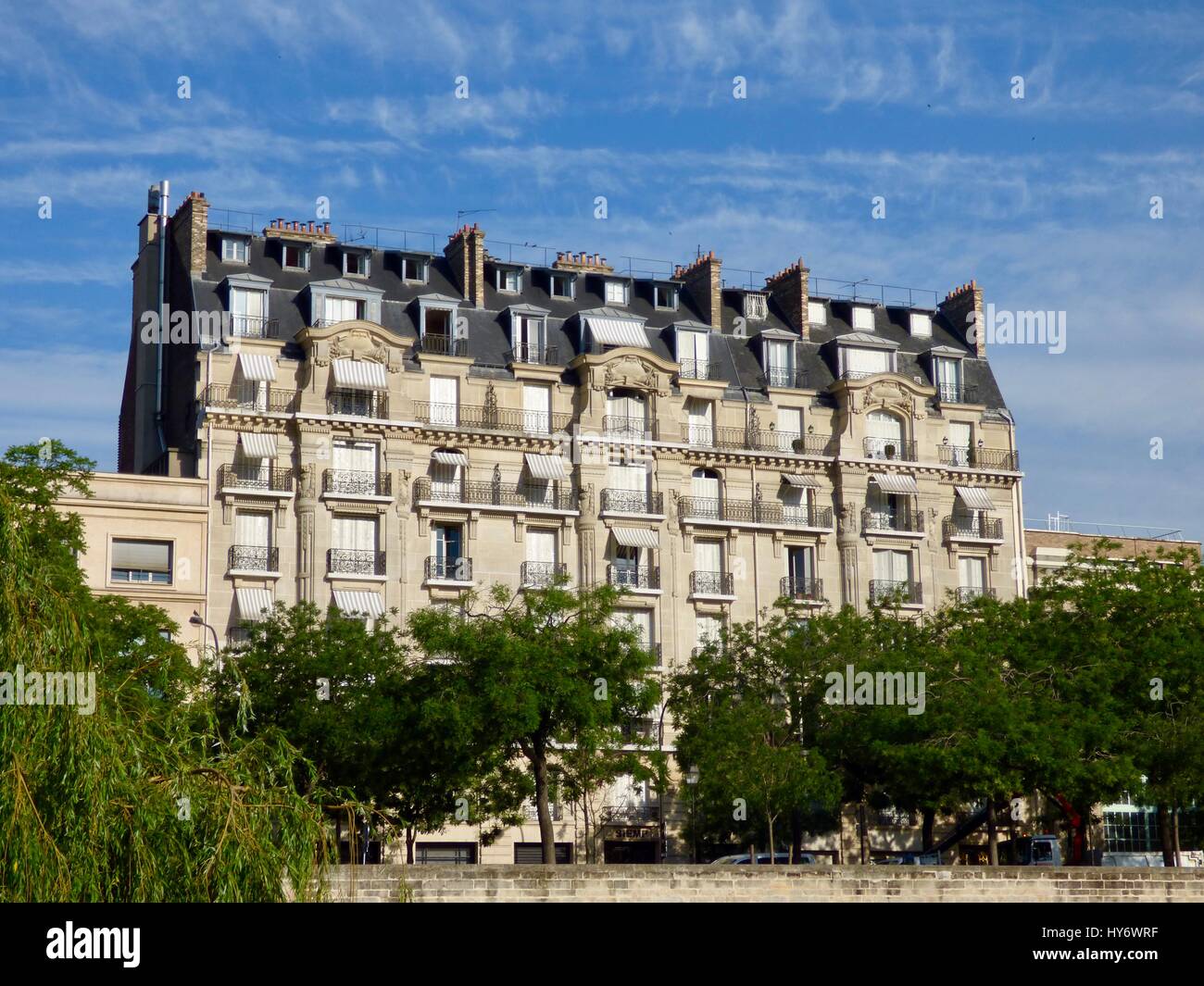 Haussmann building against a blue sky. 4th arrondissement. Paris, France Stock Photo