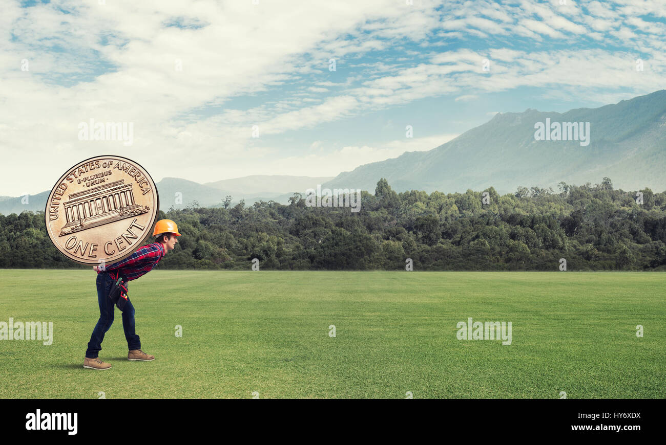 Builder man carry coin Stock Photo Alamy