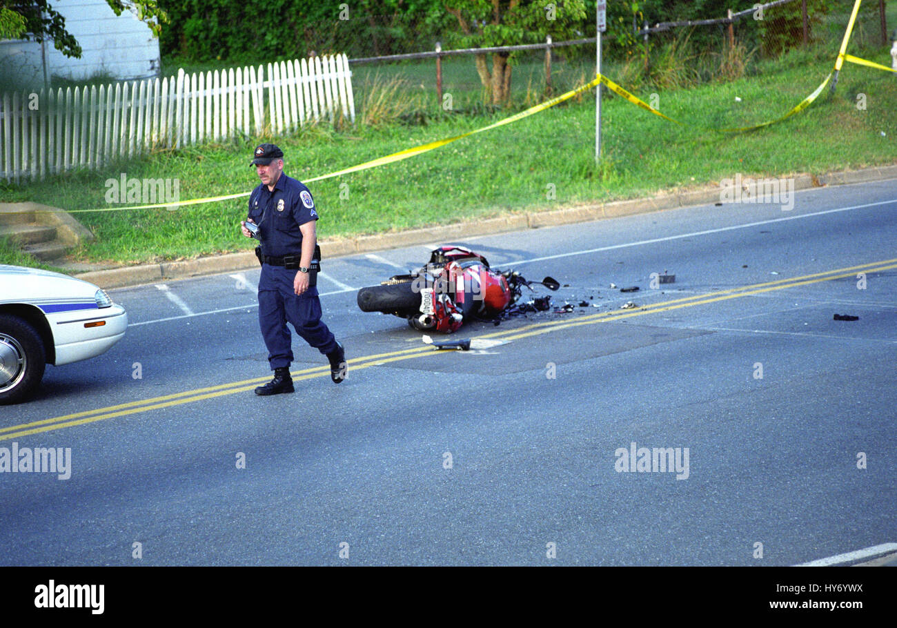 policeman investigate a motorcycle accident where the rider was killed