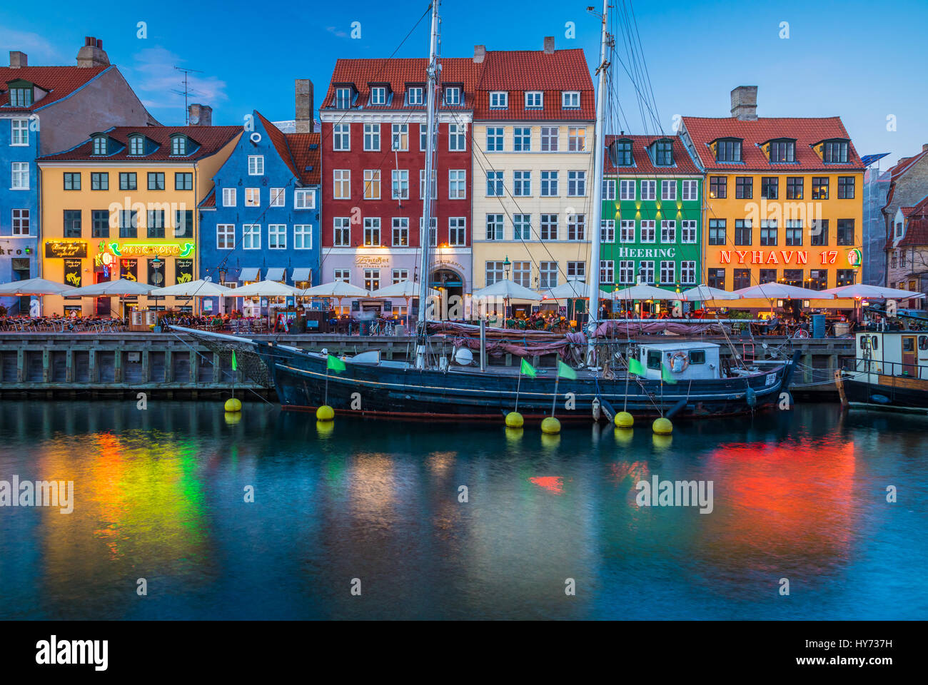 Nyhavn is a colourful 17th century waterfront, canal and popular entertainment district in Copenhagen, Denmark. Stock Photo