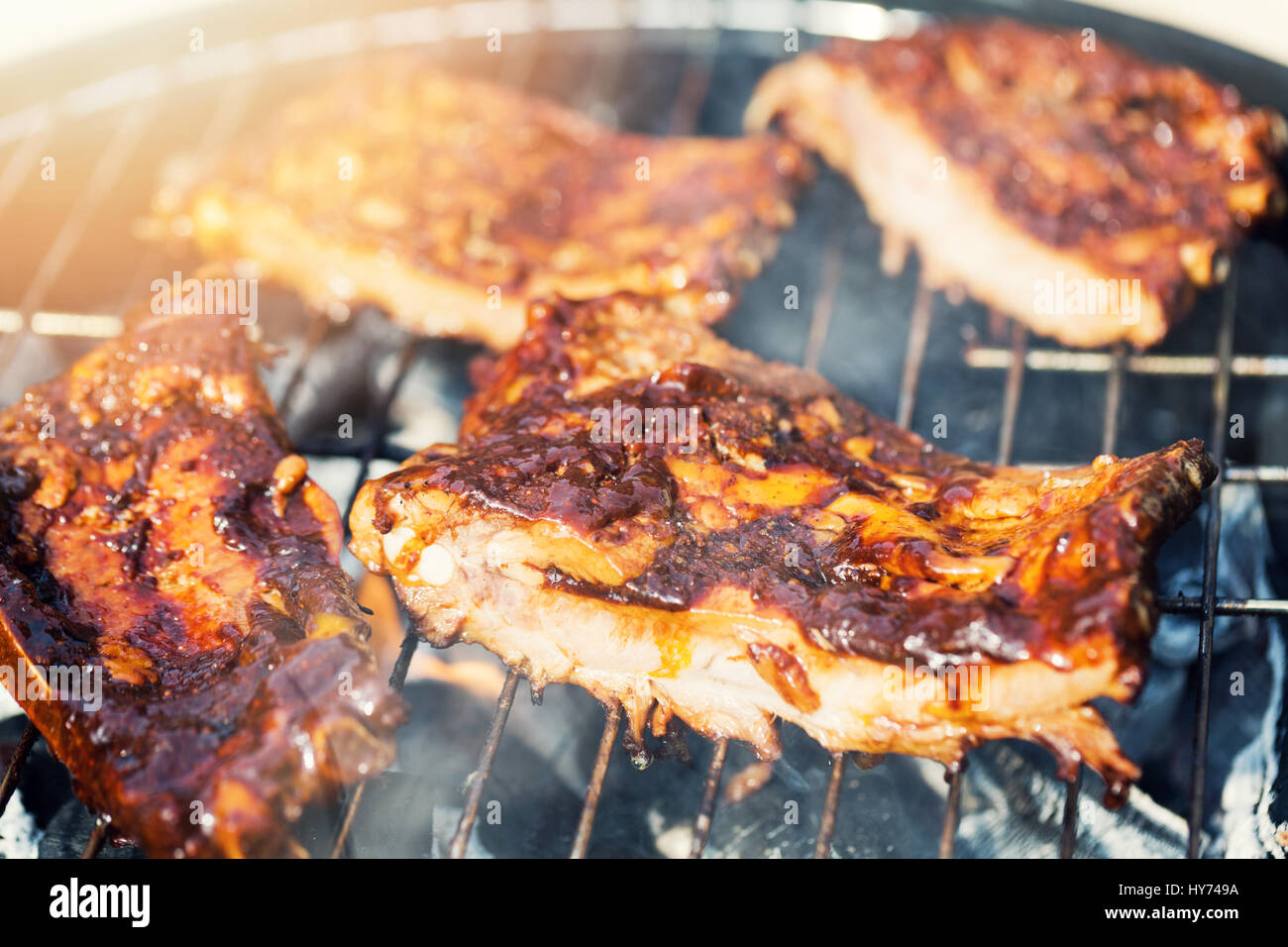 american bbq - preparing beef ribs on charcoal grill Stock Photo