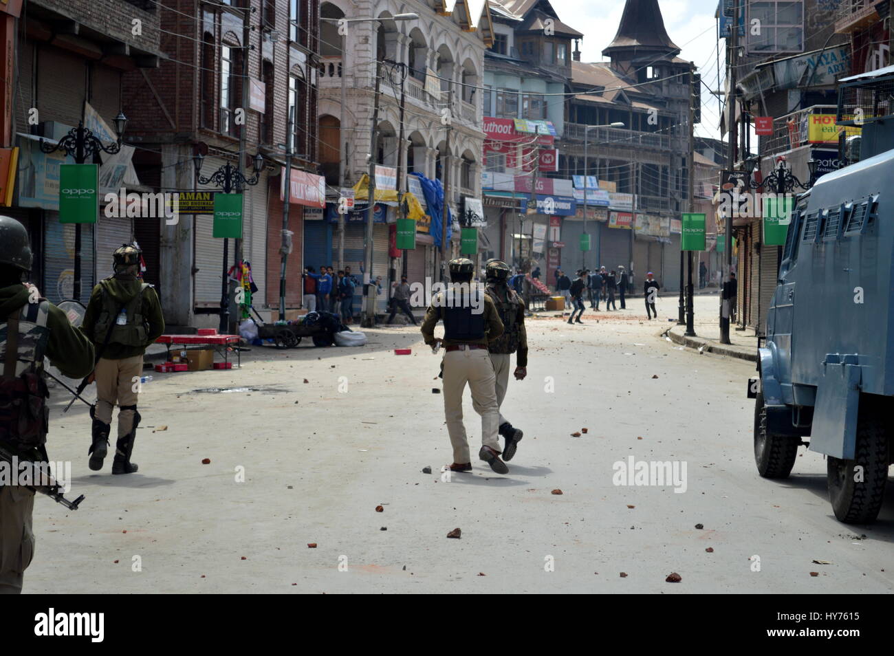 Srinagar, India. 01st Apr, 2017. Paramilitary soldiers rush near the Lal Chowk in Srinagar on Saturday after few gunshots were heard near Taj Hotel in historical Business hub Lal Chowk in Srinagar in India controlled Kashmir, on 1 April 2017 as Kashmiri youth protesters heavy stone pelting at Paramilitary and police and police use heavy teargas shelling to dispurse kashmiri protesters assemble around commercial areas in the Srinagar city. Credit: Zahid Hussain Bhat/Pacific Press/Alamy Live News Stock Photo