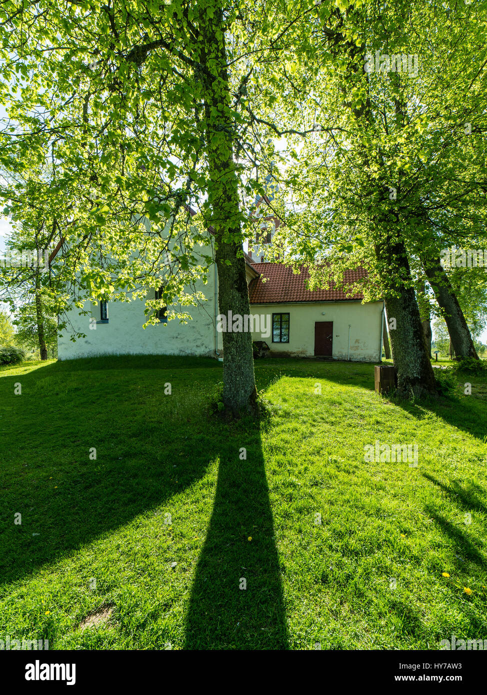 countryside church building in summer in small village Stock Photo - Alamy