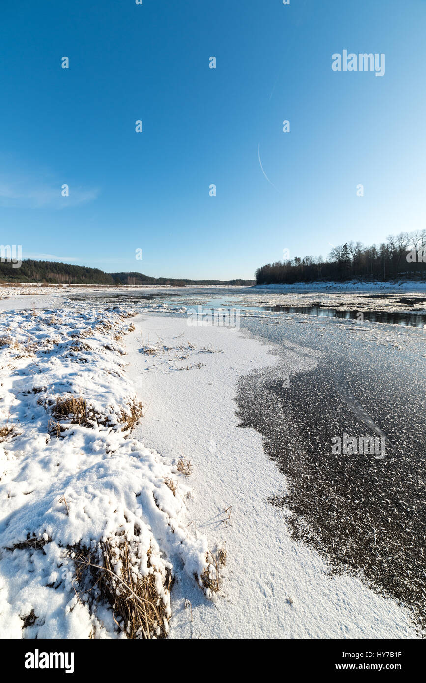 beautiful snowy winter landscape with frozen river and blue sky Stock ...