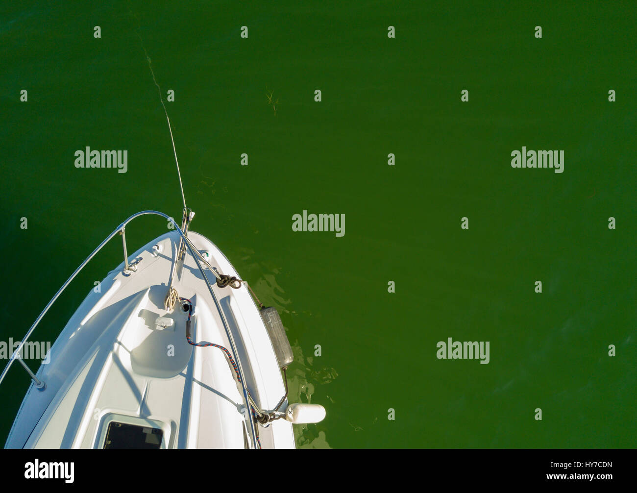 View of small boat cruiser in the ocean from above. Room for Copy Stock Photo