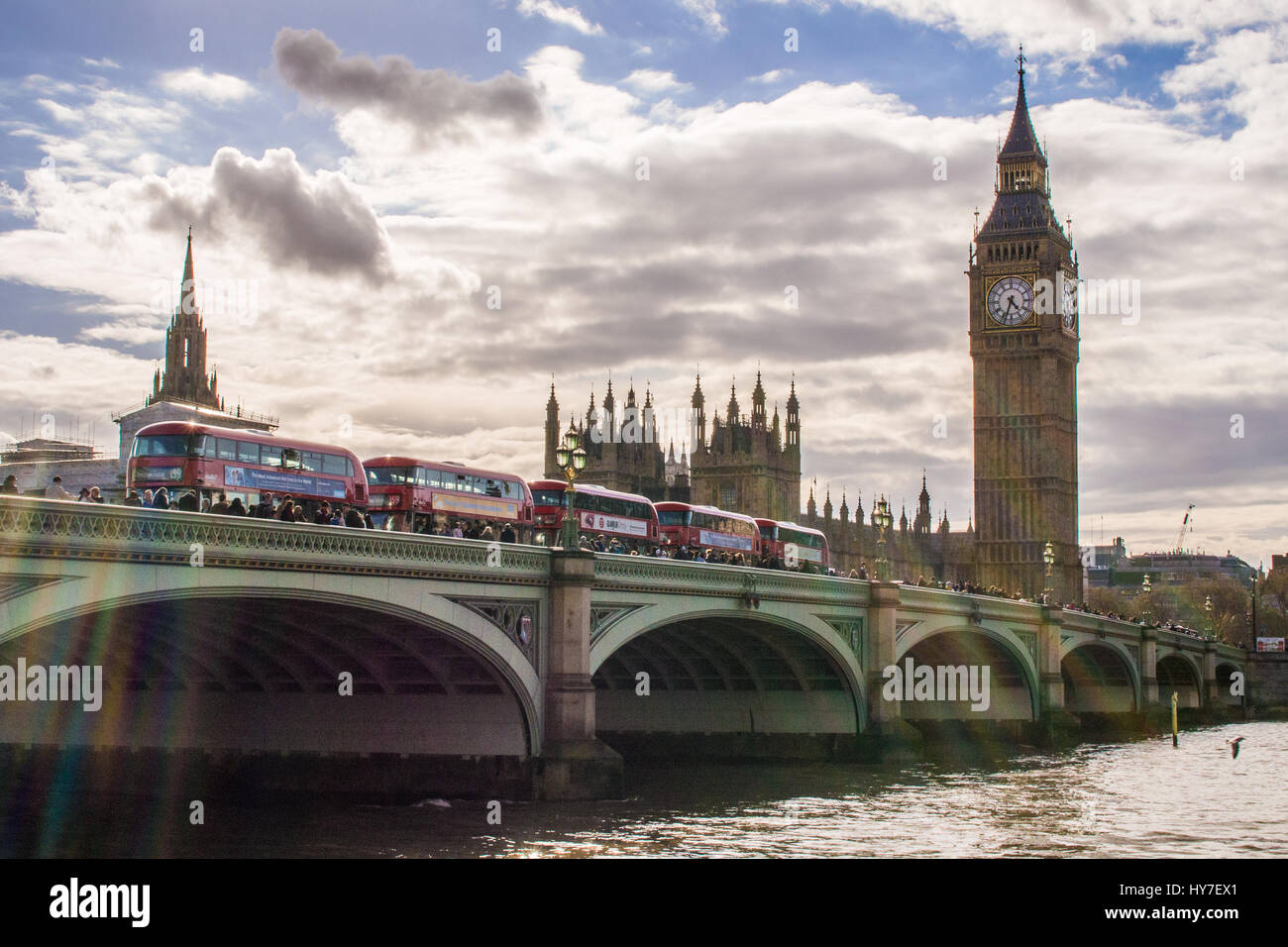 Buses on Westminster Bridge with Elizabeth Tower behind (Which houses Big Ben), London, England. Stock Photo