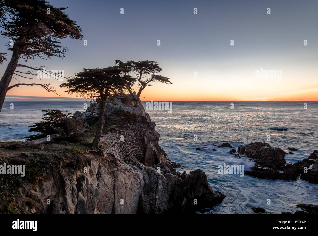 Lone Cypress tree view at sunset  along famous 17 Mile Drive - Monterey, California, USA Stock Photo