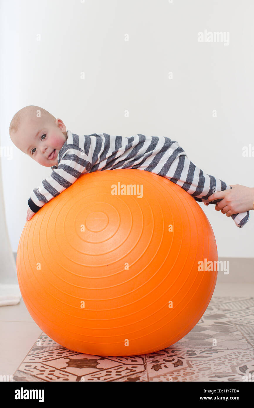 Smiling kid on fitball Stock Photo