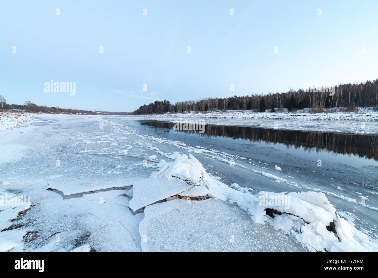 beautiful snowy winter landscape with frozen river and blue sky Stock ...