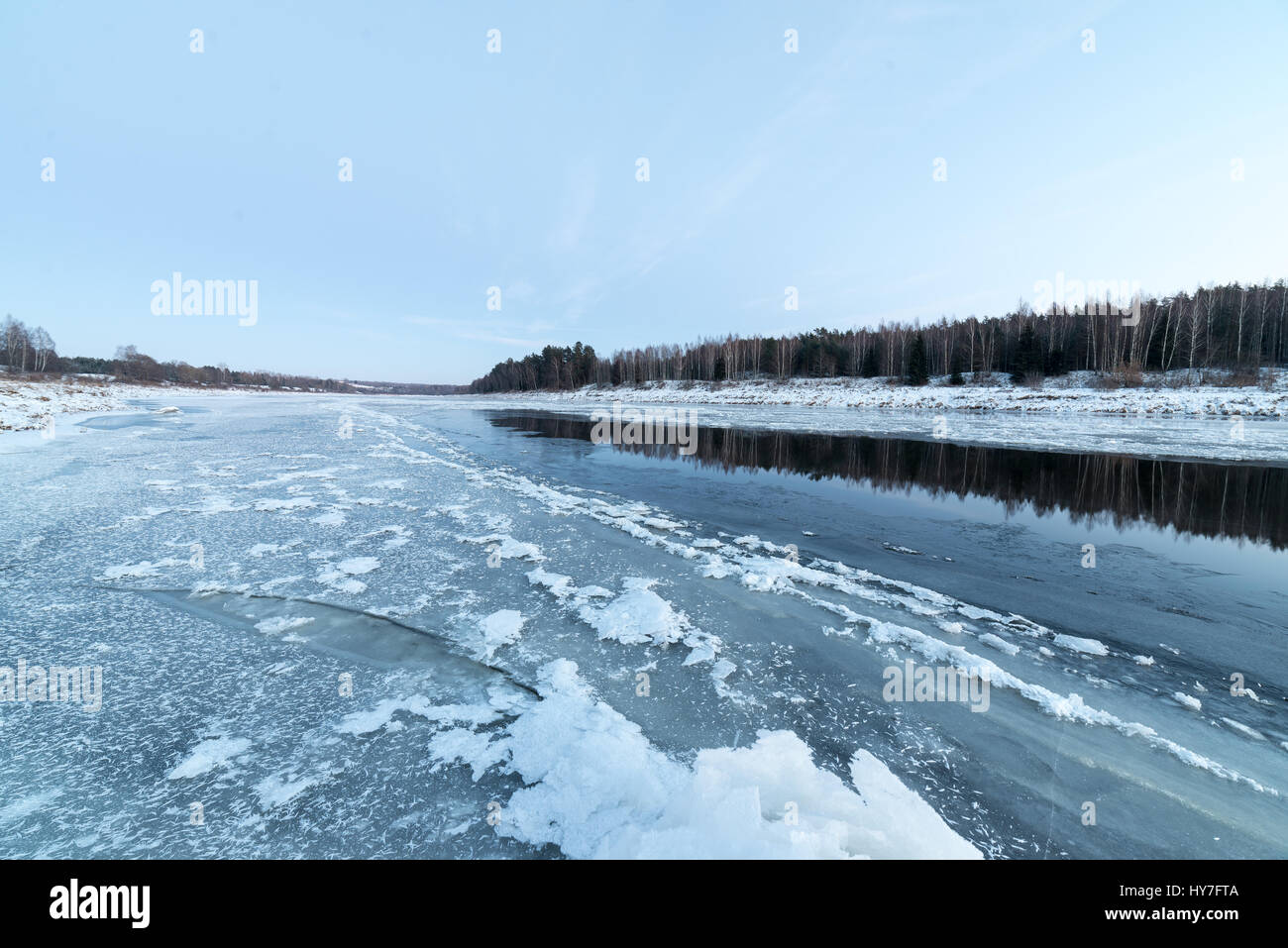 beautiful snowy winter landscape with frozen river and blue sky Stock ...