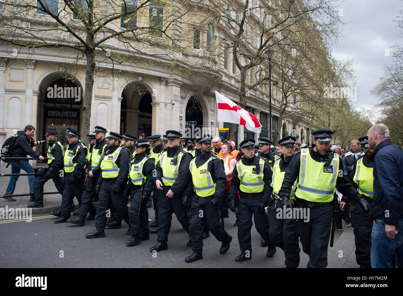 London, UK. 1st April, 2017.  The English Defence League (EDL) and Britain First held a protest march through London. The Britain First group were protesting against terrorism in response to the reason terrorist attack in London on March the 22nd 2017.  Several police escorted the small crowd of demonstrators. Andrew Steven Graham/Alamy Live News Stock Photo