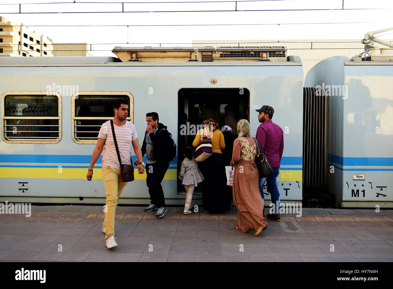 Cairo. 31st Mar, 2017. Passengers get on and off a metro train at Maadi metro station in Cairo, Egypt on March 31, 2017. Egypt has doubled Cairo metro fare amid financial difficulties and nearly 3.5 million commuters relying on Cairo's metro everyday fumed by the move, as they already suffered sharp rise in living costs. Credit: Zhao Dingzhe/Xinhua/Alamy Live News Stock Photo