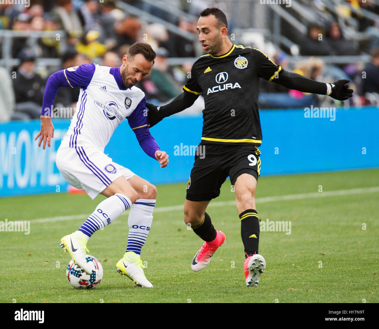 April 1, 2017: Orlando City SC midfielder Scott Sutter (21) fights for the ball against Columbus Crew SC forward Justin Meram (9) in their match at Mapfre Stadium in Columbus, Ohio. Brent Clark/Alamy Stock Photo