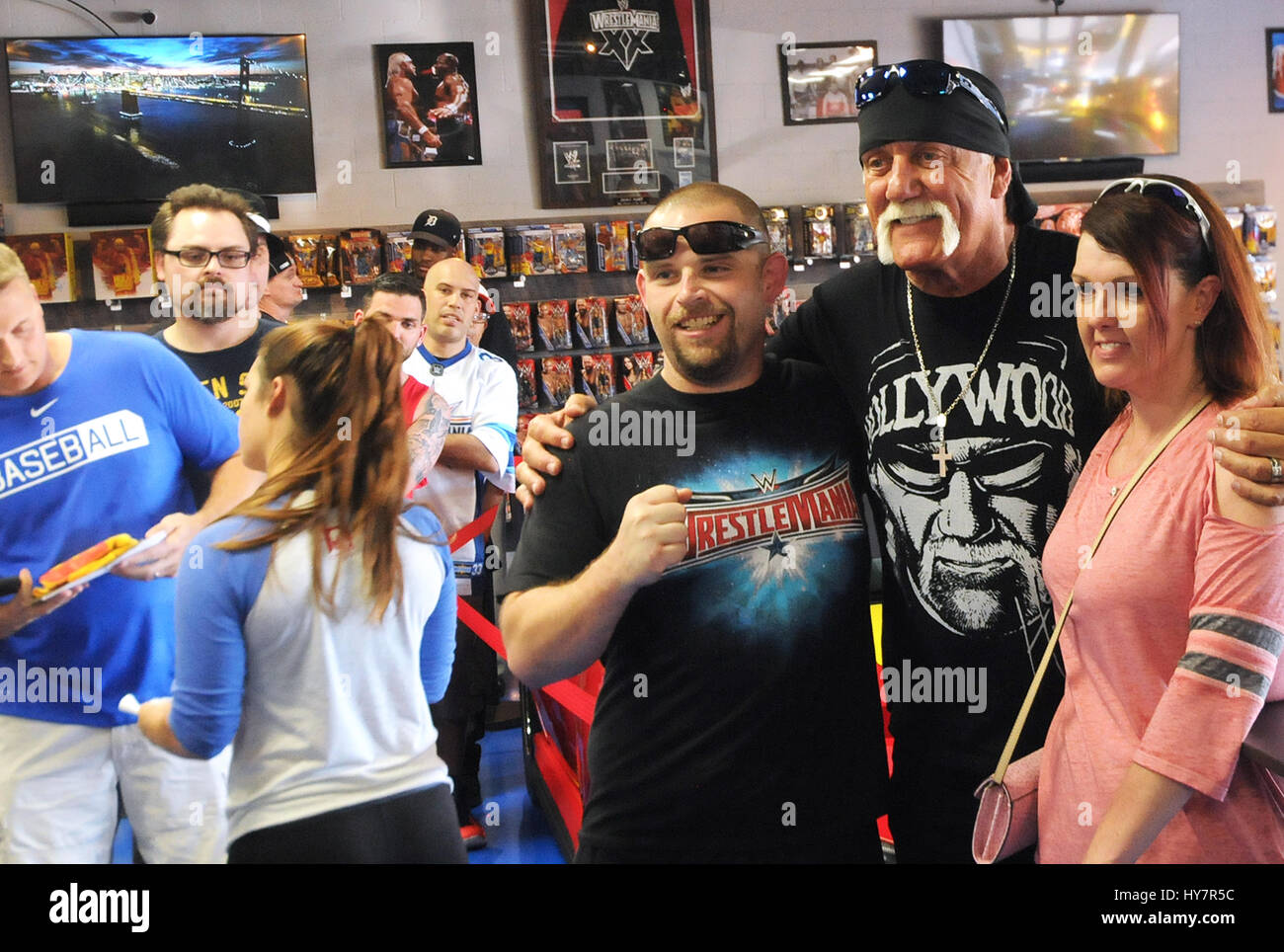 Orlando, Florida, USA. 1st April, 2017. Semi-retired professional wrestler Terry Gene Bollea, better known by his ring name Hulk Hogan, poses for a photograph with fans at Hogan's Beach Shop, his retail merchandise store which opened on March 30, 2017 in Orlando, Florida. Credit: Paul Hennessy/Alamy Live News Stock Photo
