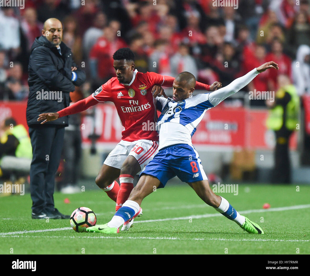 Lisbon, Portugal. 1st Apr, 2017. Benfica's Nelson Semedo (front L) vies with Porto's Yacine Brahimi during the Portuguese League soccer match at Luz stadium in Lisbon, Portugal, April 1, 2017. The match ended 1-1. Credit: Zhang Liyun/Xinhua/Alamy Live News Stock Photo