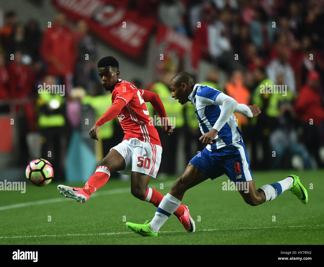 Lisbon, Portugal. 1st Apr, 2017. Benfica's Nelson Semedo (L) vies with Porto's Yacine Brahimi during the Portuguese League soccer match at Luz stadium in Lisbon, Portugal, April 1, 2017. The match ended 1-1. Credit: Zhang Liyun/Xinhua/Alamy Live News Stock Photo