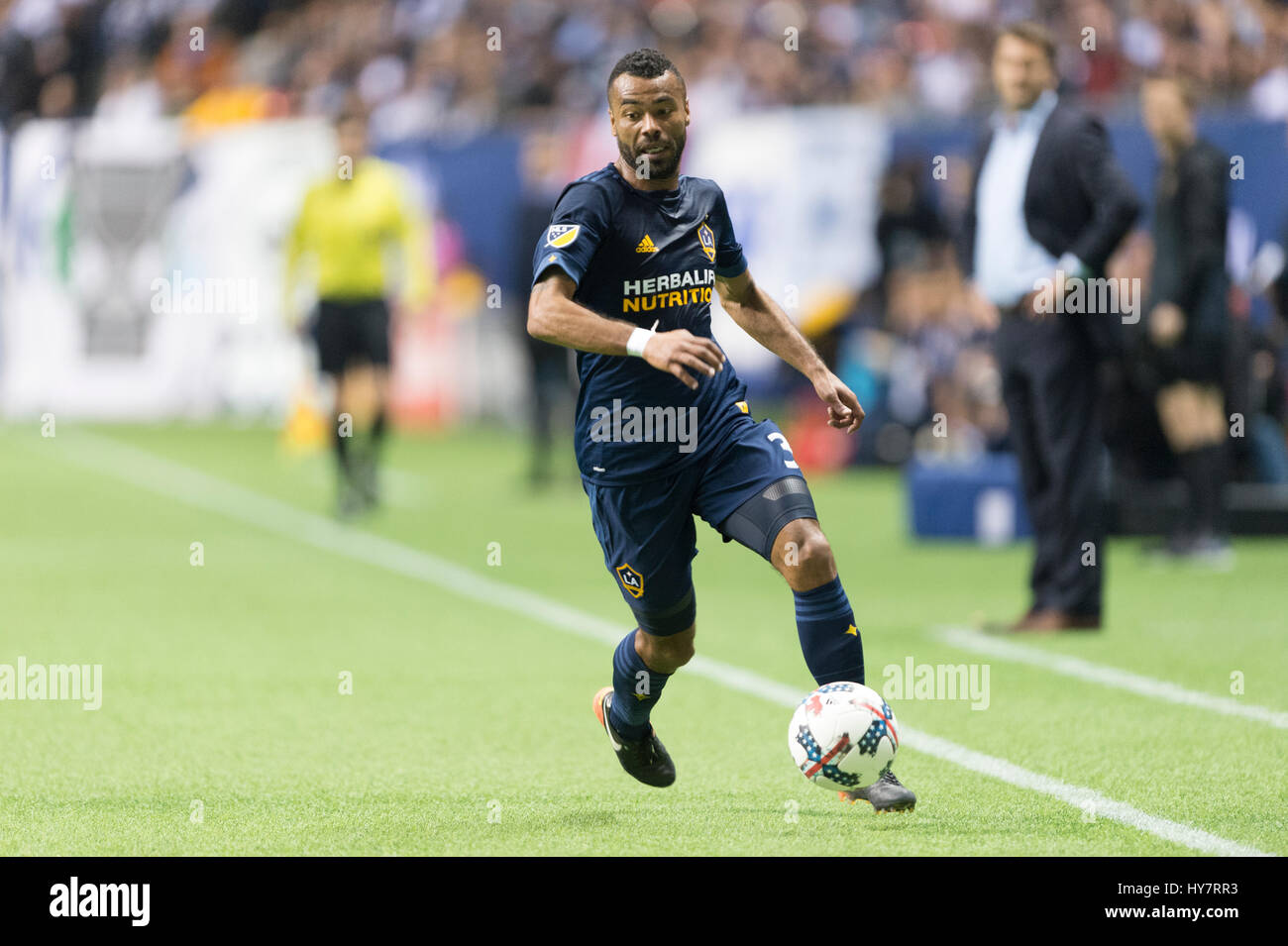 Vancouver, Canada. 1 April, 2017. Ashley Cole (3) of Los Angeles Galaxy moving with ball. Vancouver defeats Los Angeles 4-2, with Whitecap goals from Cristian Techera (13), Fredy Montero (12) and 2 goals from Matias Laba (15), Vancouver Whitecaps vs Los Angeles Galaxy, BC Place Stadium.  © Gerry Rousseau/Alamy Live News Stock Photo