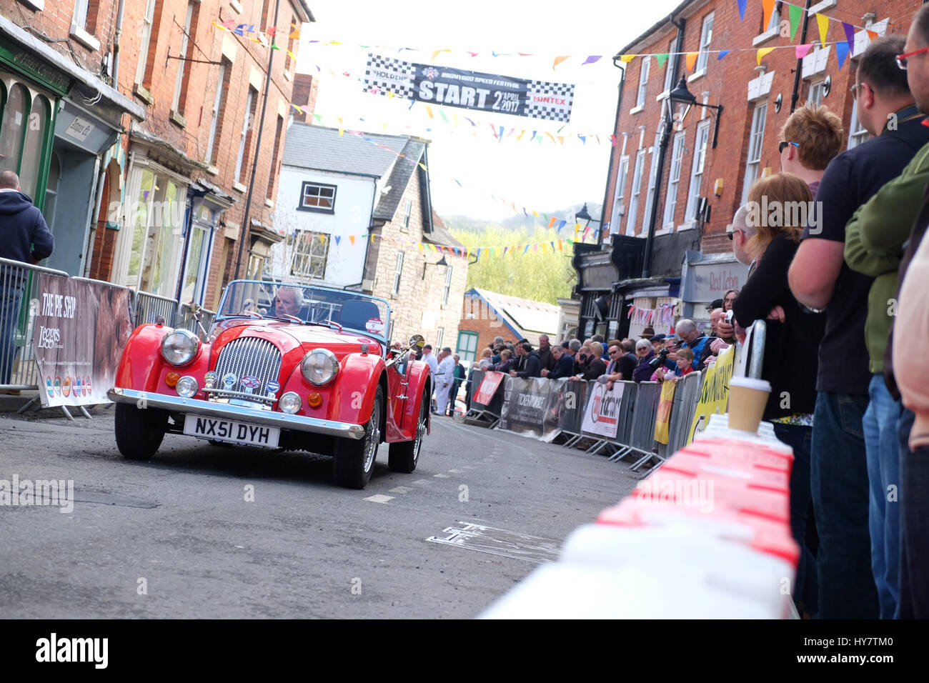 Bromyard Speed Festival, Herefordshire, UK - April 2017 - Vintage and classic cars roar through the town centre of Bromyard as fans watch at Bromyard for the 2nd Speed Festival. The photo shows a Morgan sports car. Photo Steven May / Alamy Live News Stock Photo