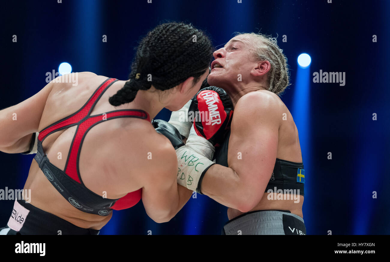 Dortmund, Germany. 01st Apr, 2017. German boxer Christina Hammer (L) in  action against Swedish boxer Maria Lindberg during the WBC World  Championship tie in Dortmund, Germany, 01 April 2017. Photo: Guido  Kirchner/dpa/Alamy