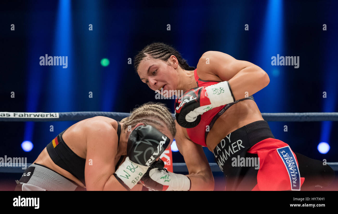 Dortmund, Germany. 01st Apr, 2017. German boxer Christina Hammer (R) in  action against Swedish boxer Maria Lindberg during the WBC World  Championship tie in Dortmund, Germany, 01 April 2017. Photo: Guido  Kirchner/dpa/Alamy