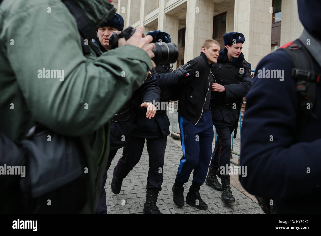 Moscow, Russia. 2nd Apr, 2017. Police arrests a man during an unsanctioned rally on Manezhnaya square in Moscow, Russia, on April 2, 2017. Police detained more than 20 participants at unsanctioned rallies in center of Moscow on Sunday. Credit: Evgeny Sinitsyn/Xinhua/Alamy Live News Stock Photo