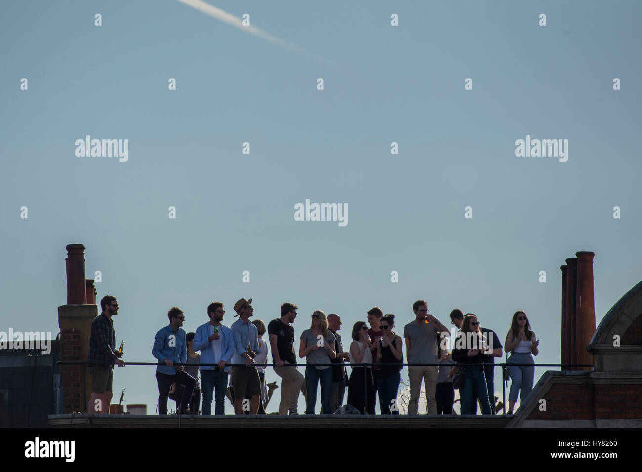 London, UK. 02nd Apr, 2017. Every vantage point is taken - The Oxford v Cambridge boat race starts at Putney and heads upstream. It is supporting cnacer research and is sponsored by Mellon Bank - London  02 Apr 2017. Credit: Guy Bell/Alamy Live News Stock Photo