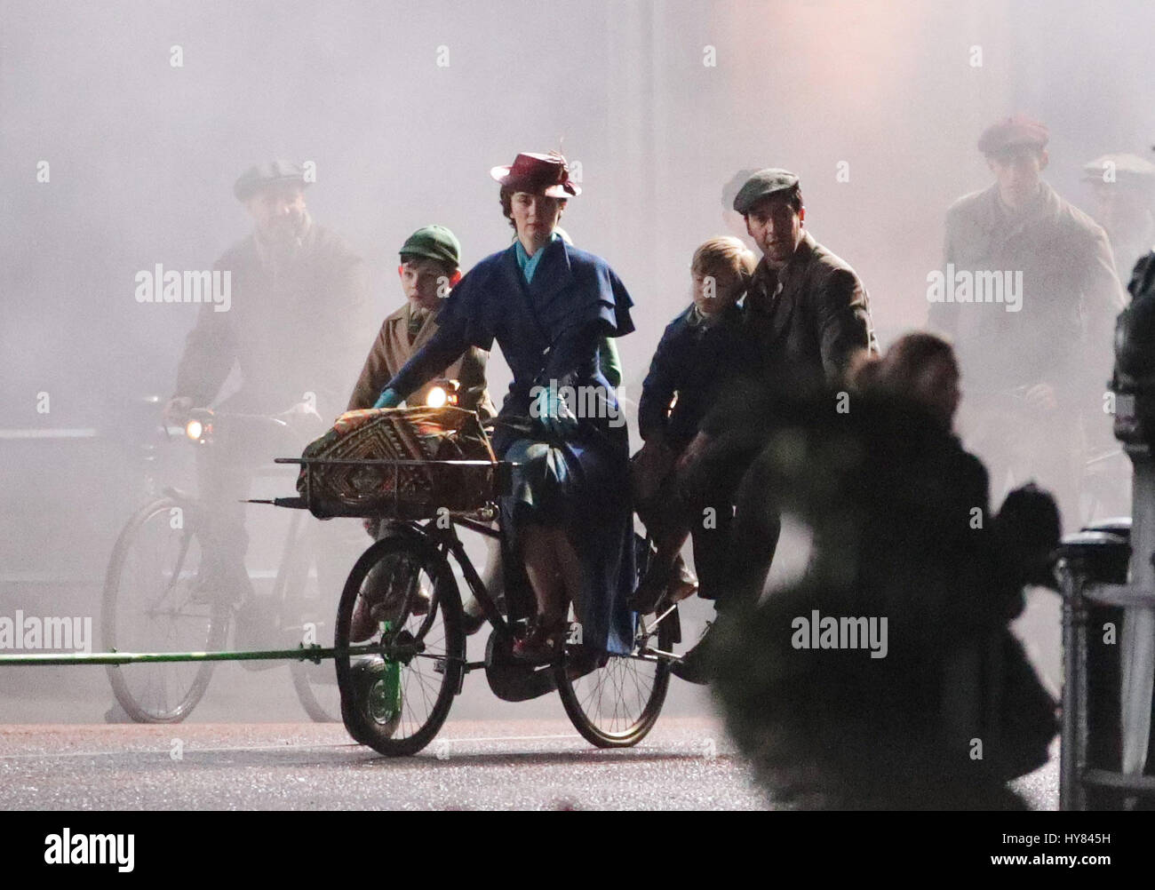Emily Blunt and Lin-Manuel Miranda take part in filming of a scene from the movie sequel Mary Poppins Returns in front of Buckingham Palace, central London. Stock Photo