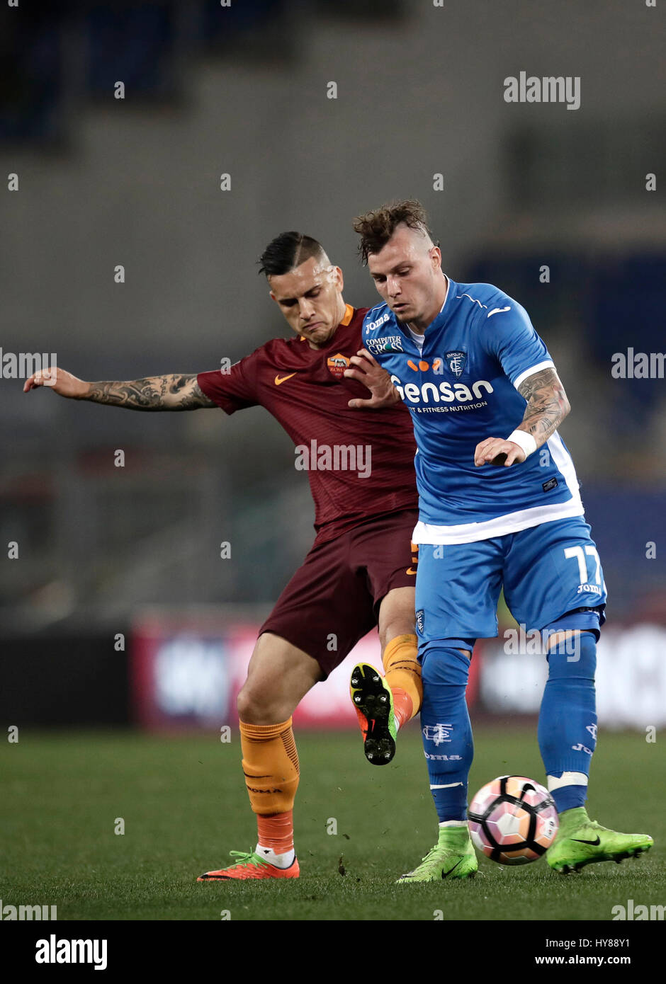 Rome, Italy. 01st Apr, 2017. Empoli Marcel Buchel, right, is challenged by Roma Leandro Paredes during the Serie A soccer match between Roma and Empoli at the Olympic stadium. Roma won 2-0. Credit: Isabella Bonotto/Pacific Press/Alamy Live News Stock Photo