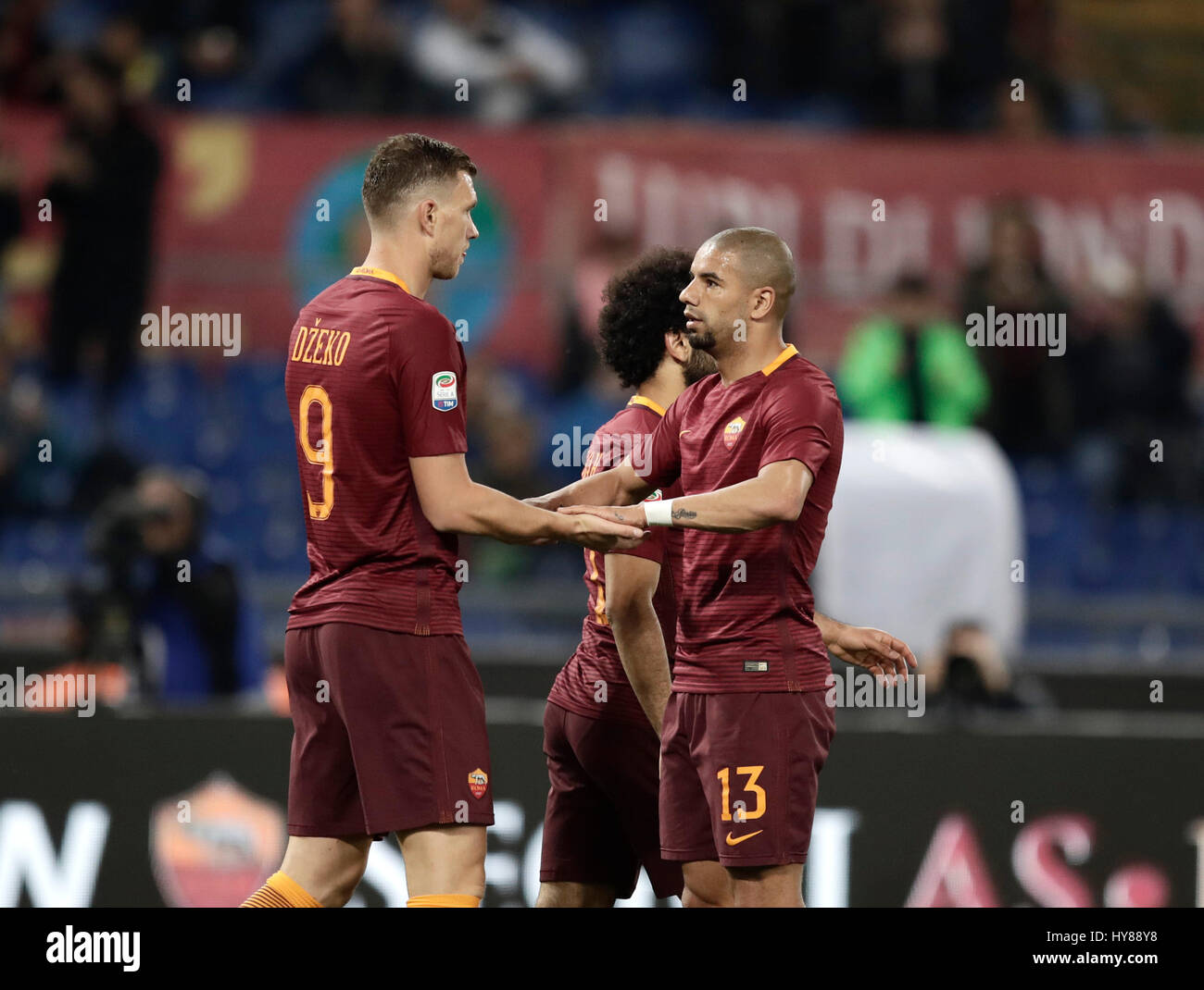 Rome, Italy. 01st Apr, 2017. Roma Edin Dzeko, left, celebrates with his ...