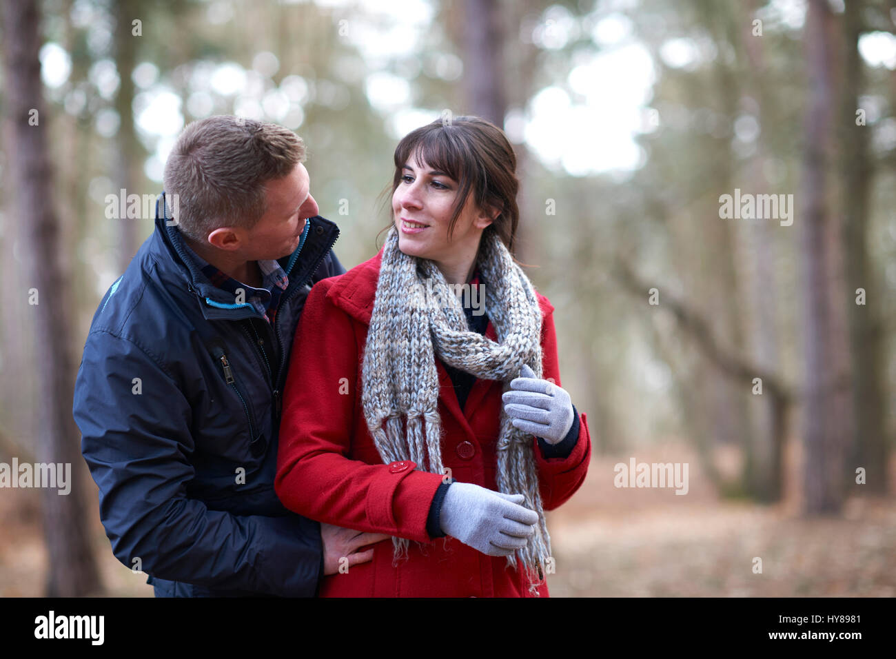 A young couple on a walk in the woods Stock Photo - Alamy