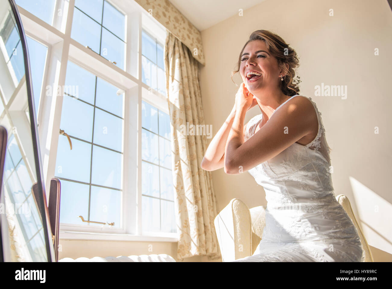A bride getting ready in her bridal suite prior to her wedding Stock Photo