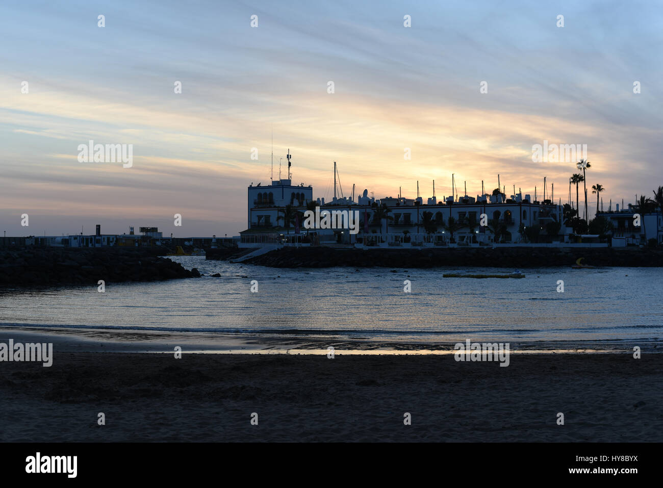 Sunset on a beach Stock Photo - Alamy