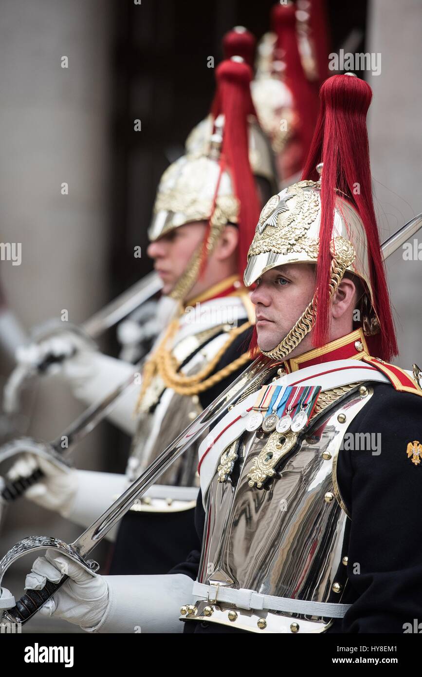 Life Guards of the Household Cavalry stand outside Whitehall during the arrival ceremony for U.S. Secretary of Defense Jim Mattis at the Ministry of Defence March 31, 2017 in London, United Kingdom. Stock Photo