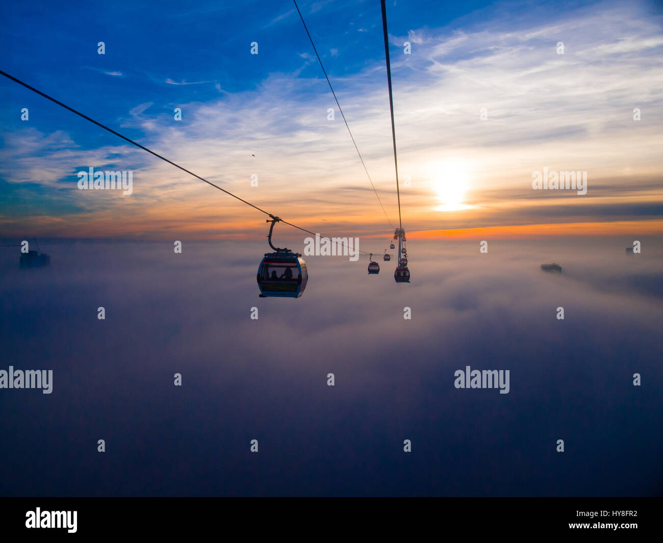The Emirates Air Line, at sunset, during the 2013 cloud inversion Stock ...