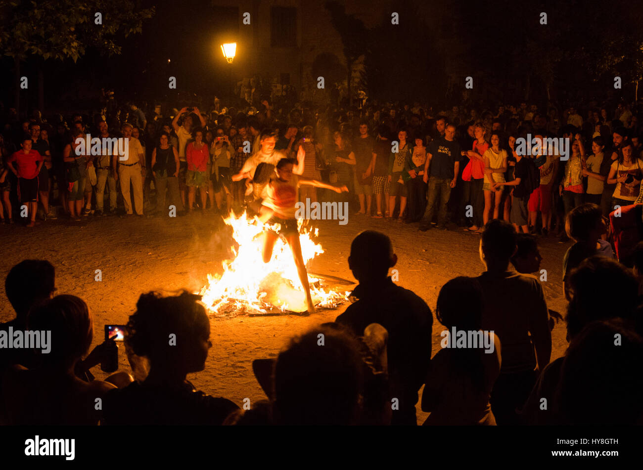 A couple jumping through the fire of a bonfire during Saint John's Stock Photo 137257137 Alamy