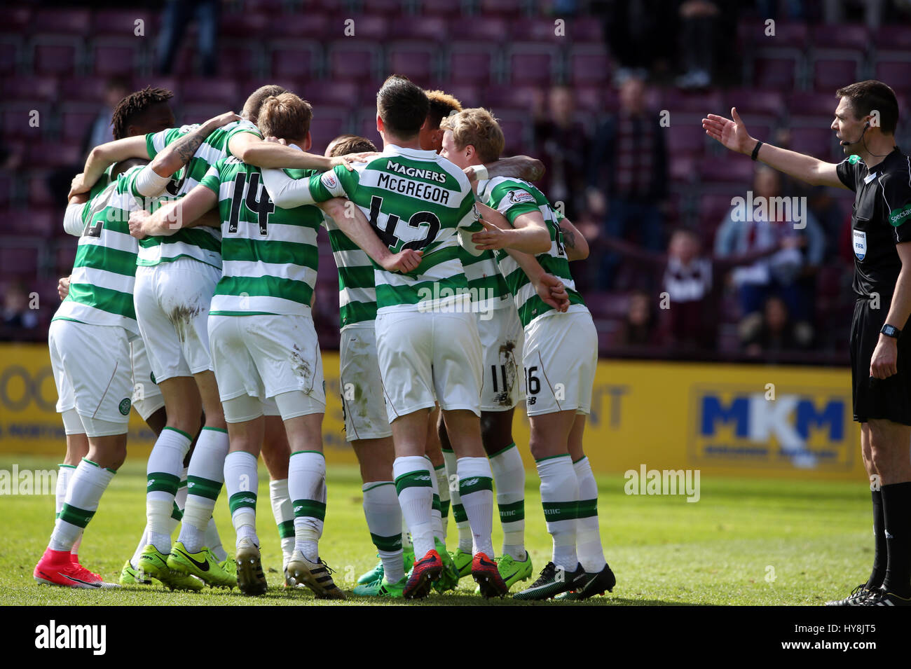 Celtic's Scott Sinclair (obscured) celebrates scoring his side's fifth goal of the game from the penalty spot and completing his hat-trick with team-mates during the Ladbrokes Scottish Premiership match at Tynecastle Stadium, Edinburgh. Stock Photo