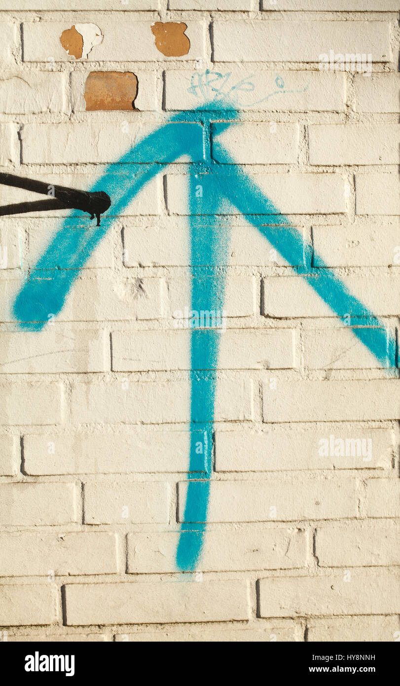 white painted brick wall, Arrow Stock Photo - Alamy