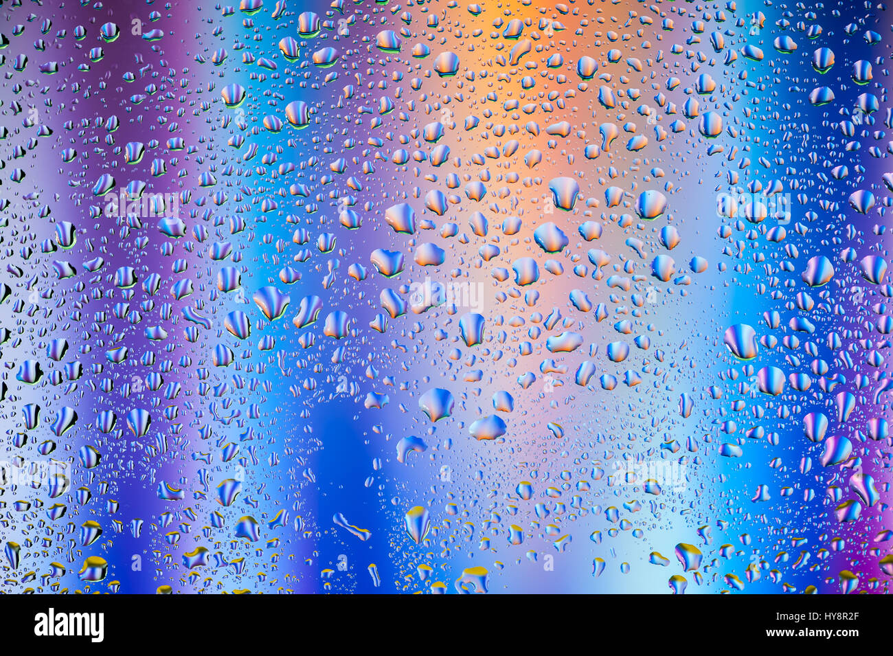 Abstract texture - Water drops on glass with blue and purple background ...