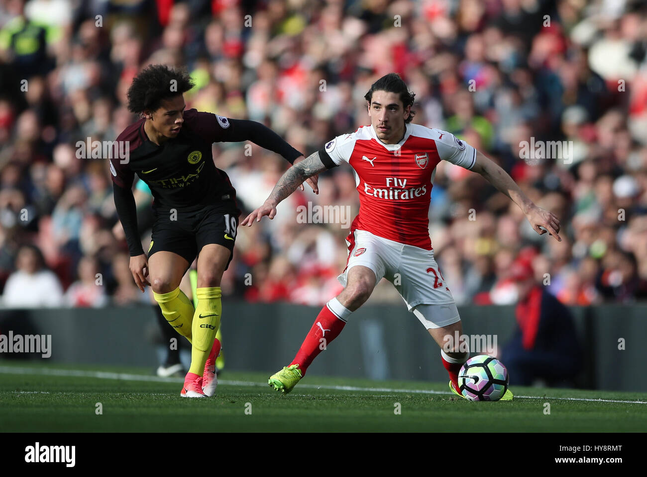 Arsenal's Hector Bellerin (right) and Manchester City's Leroy Sane battle for the ball during the Premier League match at the Emirates Stadium, London. PRESS ASSOCIATION Photo. Picture date: Sunday April 2, 2017. See PA story SOCCER Arsenal. Photo credit should read: Nick Potts/PA Wire. RESTRICTIONS: No use with unauthorised audio, video, data, fixture lists, club/league logos or 'live' services. Online in-match use limited to 75 images, no video emulation. No use in betting, games or single club/league/player publications. Stock Photo