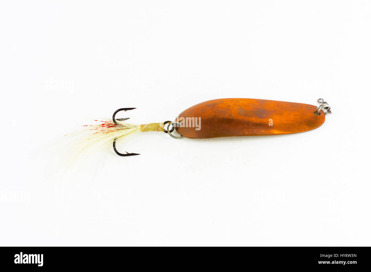 Exhibition of self-made fishing metal lures. Bait for fishing in the shape  of a spoon with a hook on a white background Stock Photo - Alamy