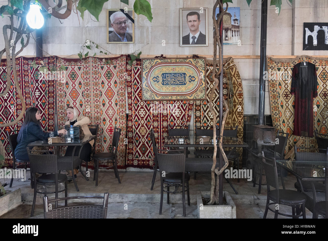 Cafe at National Museum of Damascus. Most left photo on wall: Khaled al-Asaad, the archaeologist killed by Isis in Palmyra Stock Photo