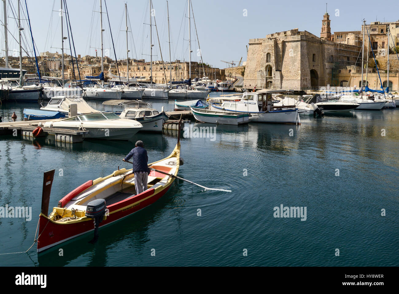 A dgħajsa, a traditional water taxi from Malta. Dockyard Creek, Birgu, Valletta. Stock Photo