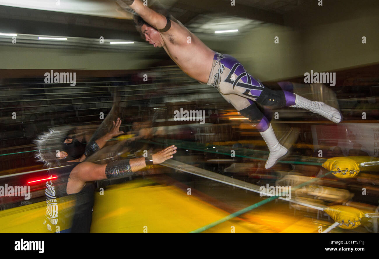 Free Wrestling in Mexico is huge, this 'sport' or 'spectacle' gets to all kink of people and eages. Wrestelers become anonymous heros behind their Stock Photo