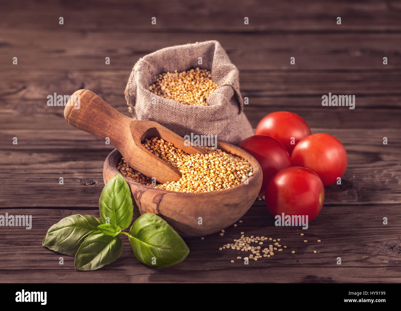 Uncooked quinoa with tomatoes and basil Stock Photo Alamy
