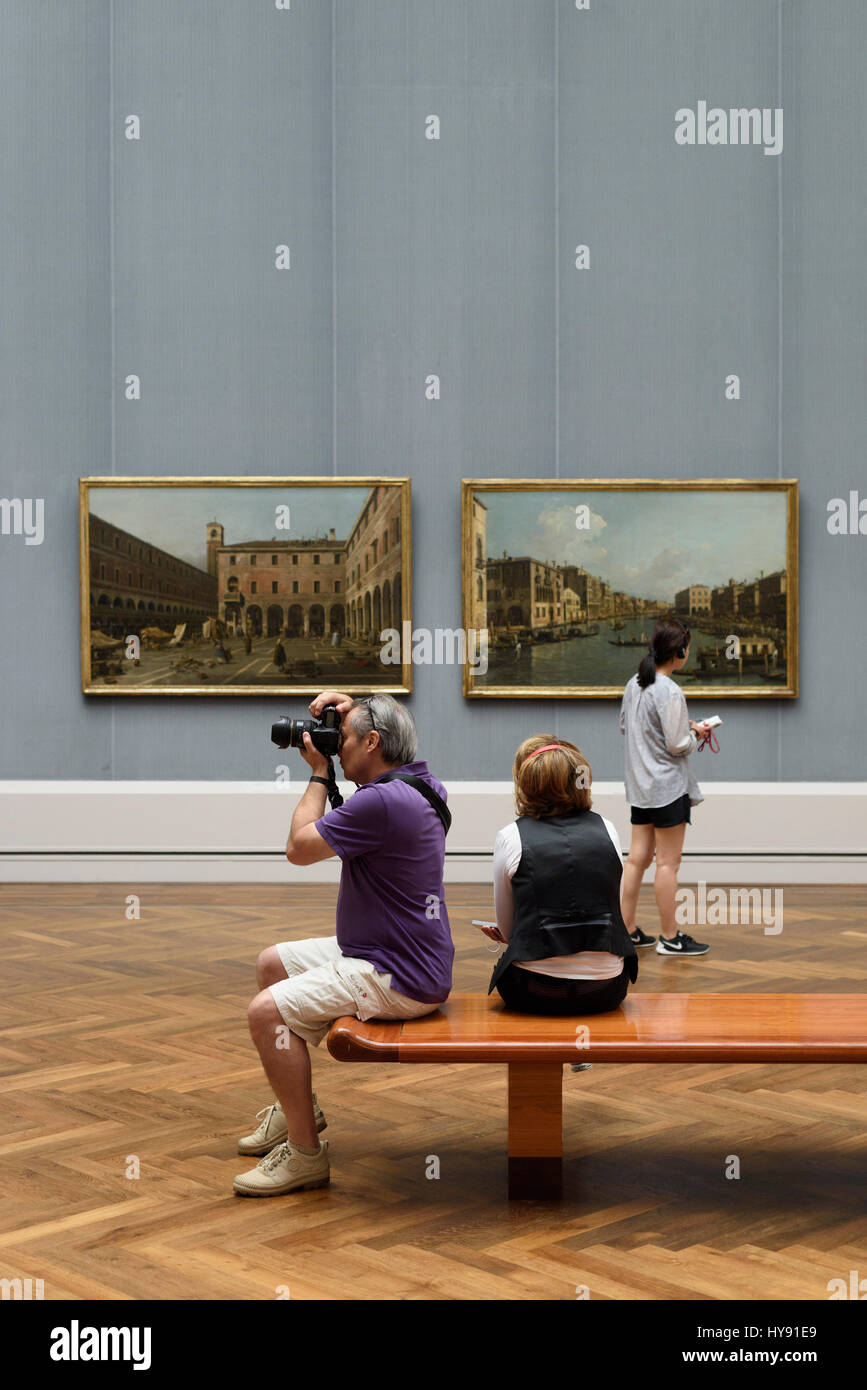 Berlin. Germany. Vistors looking at artwork in the Gemäldegalerie. Stock Photo