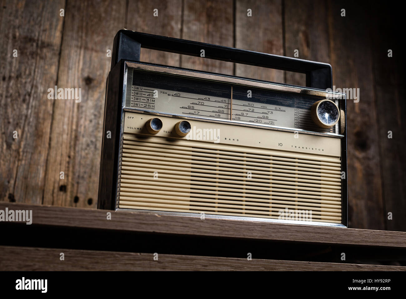 Old vintage radio on a wooden background Stock Photo - Alamy