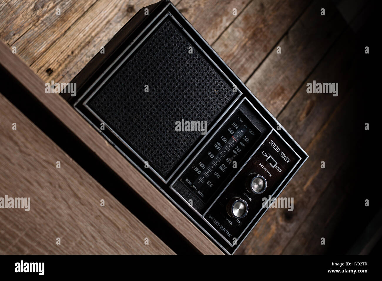 Old vintage radio on a wooden background Stock Photo - Alamy