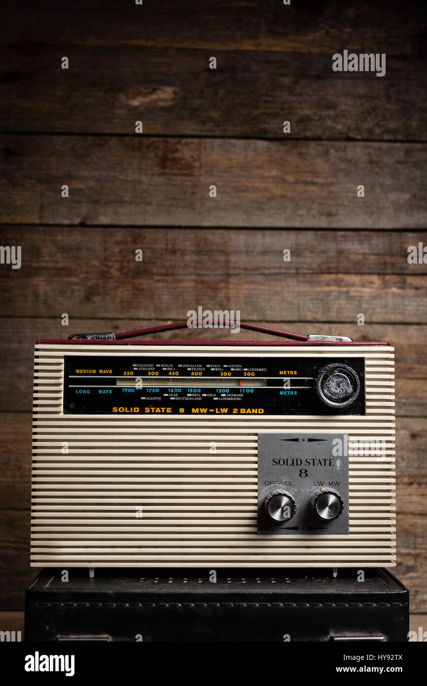 Old vintage radio on a wooden background Stock Photo - Alamy