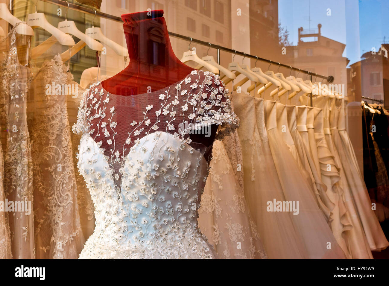 Wedding, white bridal gown dress on dummy mannequin on display in a window of a bridal fashion store shop, Italian style elegance. Rome, Italy, Europe Stock Photo
