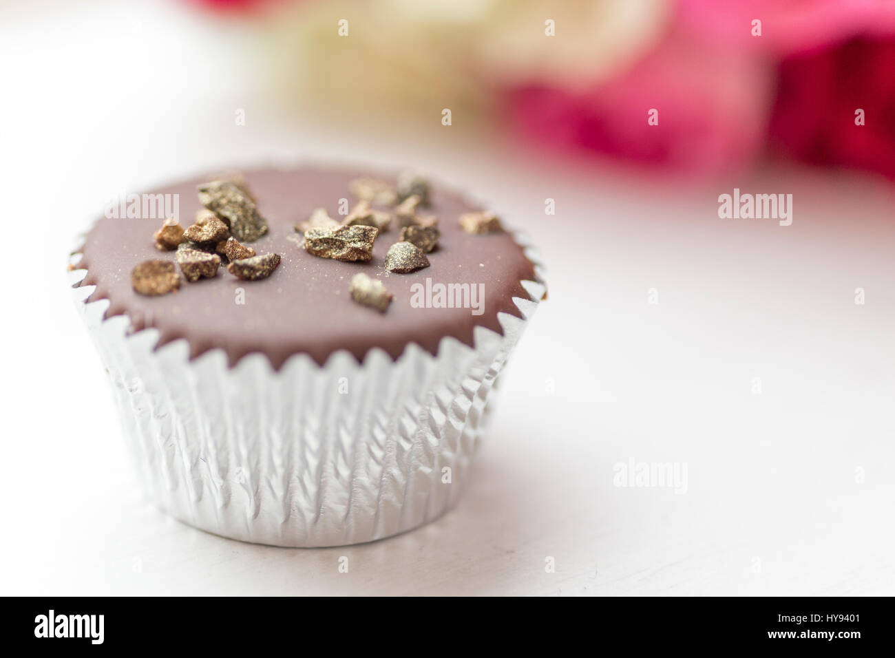 Chocolate mini cupcake with gold sprinkles Stock Photo